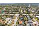 Aerial view of a suburban community with lovely homes, well-kept yards, mature trees, and commercial services at 7507 3Rd Nw Ave, Bradenton, FL 34209