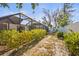 Beautifully landscaped backyard with a screen enclosure, offering a private and tranquil outdoor space at 7507 3Rd Nw Ave, Bradenton, FL 34209