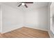 Neutral bedroom showcasing new flooring, a window view, and a ceiling fan at 7507 3Rd Nw Ave, Bradenton, FL 34209