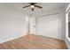 Bedroom featuring new flooring, a closet, and a door with an attached ensuite at 7507 3Rd Nw Ave, Bradenton, FL 34209