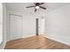 Bedroom featuring new flooring, a closet, and a door with an attached ensuite at 7507 3Rd Nw Ave, Bradenton, FL 34209