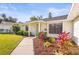 Well-maintained home with a manicured lawn, colorful plants, and a welcoming front entrance at 7507 3Rd Nw Ave, Bradenton, FL 34209