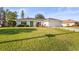 Attractive one-story home featuring a lush green lawn and beautifully landscaped front yard at 7507 3Rd Nw Ave, Bradenton, FL 34209