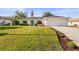 Charming single-story home with a well-manicured lawn, updated landscaping, and a bright, inviting facade at 7507 3Rd Nw Ave, Bradenton, FL 34209