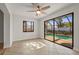 Light-filled living room includes a ceiling fan, large sliding glass doors to the pool, and tile floors at 7507 3Rd Nw Ave, Bradenton, FL 34209