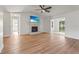 Spacious living room showcases a fireplace, ceiling fan, and seamless transition to the pool area at 7507 3Rd Nw Ave, Bradenton, FL 34209