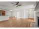 Expansive open floor plan with a fireplace, light hardwood flooring, and views to other rooms at 7507 3Rd Nw Ave, Bradenton, FL 34209