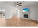 Inviting living room boasts a cozy fireplace, ceiling fan and flows into adjacent rooms at 7507 3Rd Nw Ave, Bradenton, FL 34209