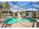 Screened in pool with spa and brick paver patio at back of home at 7507 3Rd Nw Ave, Bradenton, FL 34209