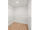Clean walk-in closet features wire shelving and wood-look floors at 7507 3Rd Nw Ave, Bradenton, FL 34209