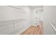 Walk-in closet includes wire shelving and wood-look flooring at 7507 3Rd Nw Ave, Bradenton, FL 34209