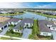 Stunning aerial view of luxurious homes surrounding a picturesque lake at 9048 Bernini Pl, Sarasota, FL 34240