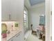Bright kitchen area with granite counters, and view into dining area at 9048 Bernini Pl, Sarasota, FL 34240