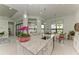 Kitchen island featuring stainless steel sink, modern fixtures, and views of the lake at 9048 Bernini Pl, Sarasota, FL 34240
