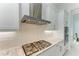 Modern kitchen featuring stainless steel appliances, gas cooktop, and white cabinetry at 9048 Bernini Pl, Sarasota, FL 34240