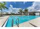 Inviting community pool with lounge seating and a beautiful clubhouse at 9048 Bernini Pl, Sarasota, FL 34240