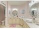 A dual vanity bathroom with decorative mirrors and vessel sinks provides a luxurious feel at 11306 77Th E St, Parrish, FL 34219