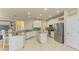 Gourmet kitchen featuring white cabinets, granite counters, and stainless steel appliances at 11306 77Th E St, Parrish, FL 34219