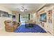 Relaxing living room with plush seating, a ceiling fan, and a view of the pool at 11306 77Th E St, Parrish, FL 34219