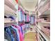 A spacious walk-in closet featuring custom shelving and ample storage space for clothes and accessories at 11306 77Th E St, Parrish, FL 34219
