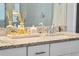 Close up of the bathroom vanity featuring granite countertops and modern fixtures at 1889 Saddlewood Cir, Port Charlotte, FL 33953