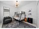 Cozy bedroom with a bunk bed, a unique light fixture, and an accent rug on tile floors at 1889 Saddlewood Cir, Port Charlotte, FL 33953