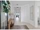 Inviting entryway with tile flooring, decorative console table and wreath, providing a warm welcome at 1889 Saddlewood Cir, Port Charlotte, FL 33953