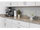 Close up of a kitchen counter featuring granite countertop, and stainless steel appliances at 1889 Saddlewood Cir, Port Charlotte, FL 33953
