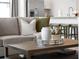 Neutral living room with a view of the kitchen bar featuring stainless steel appliances at 1889 Saddlewood Cir, Port Charlotte, FL 33953