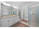 Bright bathroom with double vanity, granite countertop, and glass-enclosed shower at 1889 Saddlewood Cir, Port Charlotte, FL 33953