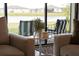 Close up of an outdoor seating area with a view of the lake, perfect for relaxation at 1889 Saddlewood Cir, Port Charlotte, FL 33953