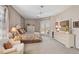 Comfortable bedroom with french doors to a screened patio with white furnishings at 2173 Muskogee Trl, Nokomis, FL 34275