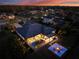 Night aerial view showcasing pool, patio, and landscaping of a stunning home at 3407 155Th E Ave, Parrish, FL 34219
