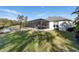 View of backyard featuring a screened in porch, outdoor kitchen, and seating area at 3407 155Th E Ave, Parrish, FL 34219