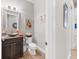 Half bathroom with a vessel sink, framed mirror, and modern decor at 3407 155Th E Ave, Parrish, FL 34219