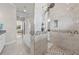Primary bath with a view to the tub, shower, and bedroom beyond at 3407 155Th E Ave, Parrish, FL 34219