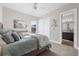 Bright bedroom featuring neutral walls, a ceiling fan, and an ensuite bathroom for added convenience at 3407 155Th E Ave, Parrish, FL 34219