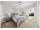 Cozy bedroom with neutral walls, carpet flooring, and a window providing natural light at 3407 155Th E Ave, Parrish, FL 34219