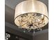 View of a crystal chandelier with black trim at 3407 155Th E Ave, Parrish, FL 34219