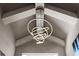 Modern chandelier with circular tiers, adding a touch of elegance to the high ceilings and contemporary design at 3407 155Th E Ave, Parrish, FL 34219
