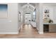 Inviting foyer with tile floors, a wine fridge, stylish decor, and a view of the front entrance at 3407 155Th E Ave, Parrish, FL 34219