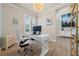 Home office featuring a chandelier, wood floors, and bright natural light at 3407 155Th E Ave, Parrish, FL 34219
