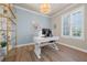 Home office featuring a chandelier, wood floors, and a bright window at 3407 155Th E Ave, Parrish, FL 34219