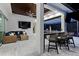 Covered outdoor space showcasing a bar, casual seating, and stylish design for entertaining at 3407 155Th E Ave, Parrish, FL 34219