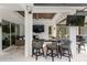 Sophisticated outdoor bar featuring stone countertops, ample seating, and seamless indoor-outdoor living at 3407 155Th E Ave, Parrish, FL 34219