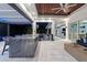 The outdoor living space features a bar, grill, and comfortable seating with LED lighting for evening enjoyment at 3407 155Th E Ave, Parrish, FL 34219