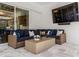 A cozy outdoor seating area features comfortable seating and a view into the luxurious interior at 3407 155Th E Ave, Parrish, FL 34219