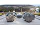 Outdoor patio boasts a fire pit surrounded by four comfortable chairs and a screened-in porch at 3407 155Th E Ave, Parrish, FL 34219