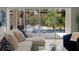 Living room view of pool and outdoor living area through large sliding glass doors at 3407 155Th E Ave, Parrish, FL 34219