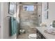 Stylish shower with glass doors, decorative tile, and a built-in shower head fixture at 3407 155Th E Ave, Parrish, FL 34219